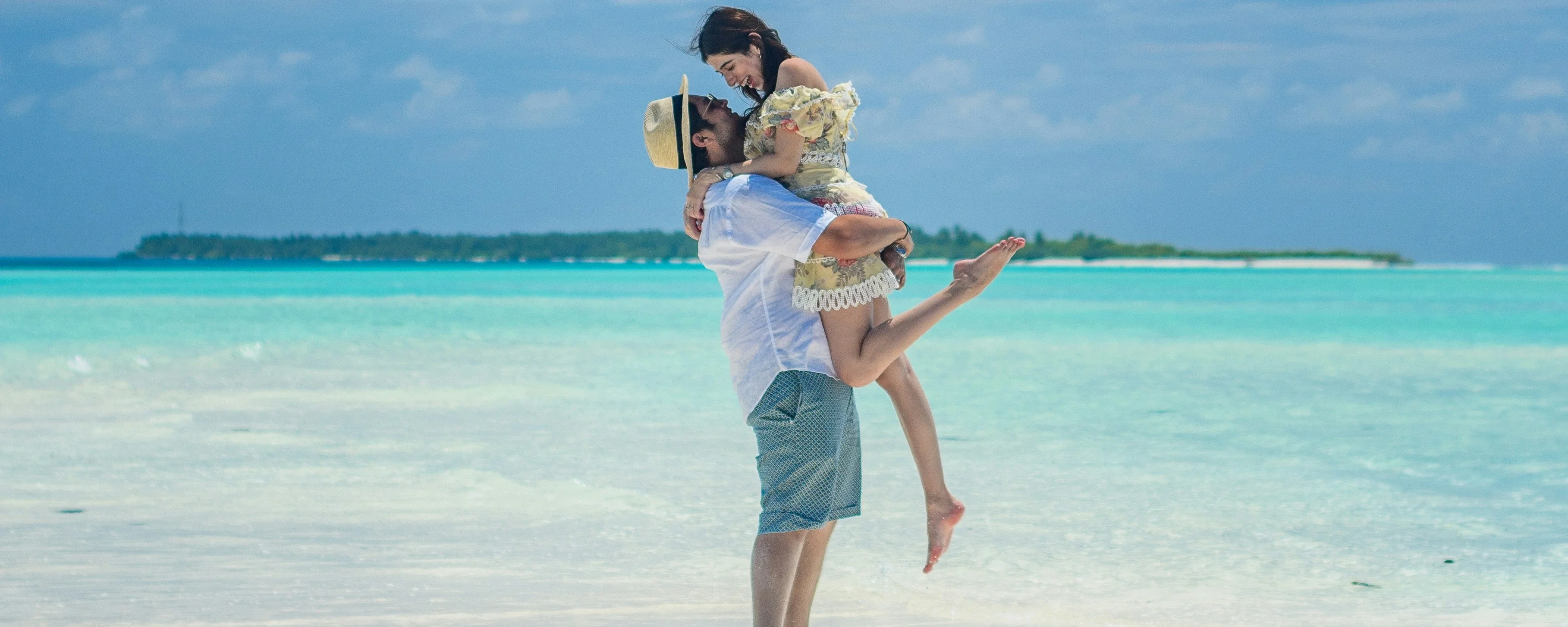 Couple enjoying Maldives tour. Romantic getaway on a beautiful beach. Perfect for a romantic escape.