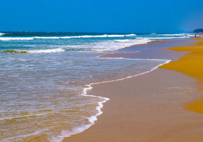 Goa tour Colva Beach waves and sand. Beautiful beach for your Goa trip. Perfect for holiday vibes.