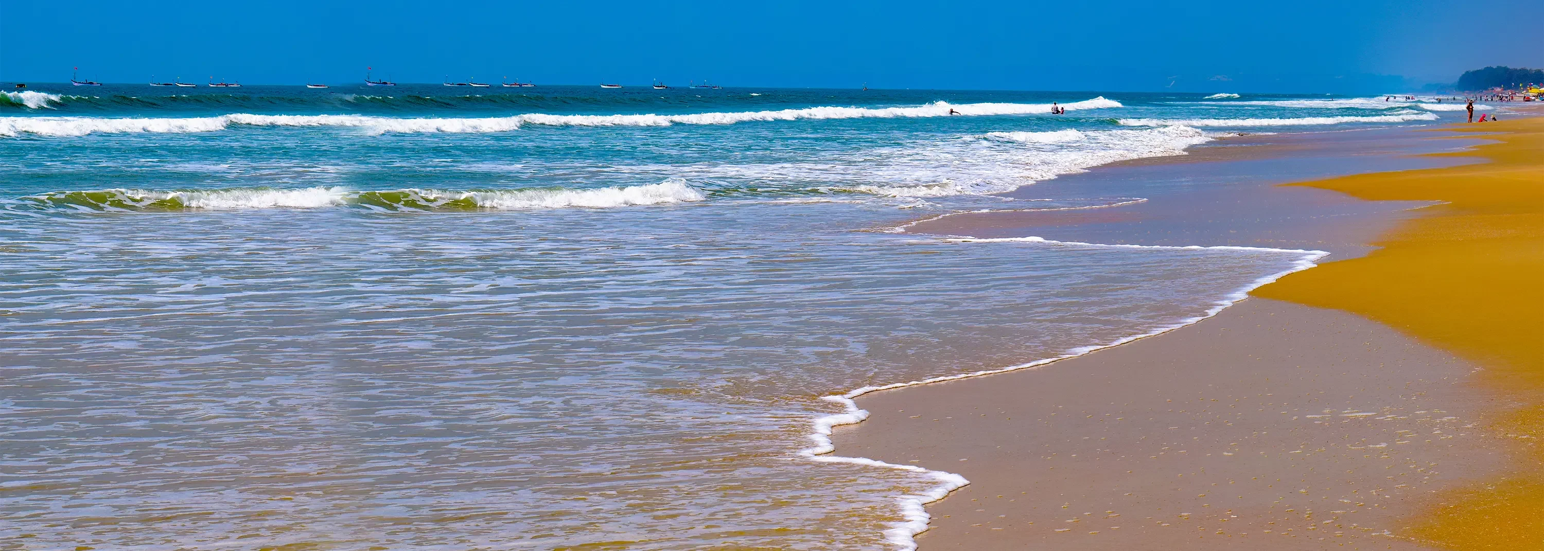 Goa tour Colva Beach waves and sand. Beautiful beach for your Goa trip. Perfect for holiday vibes.