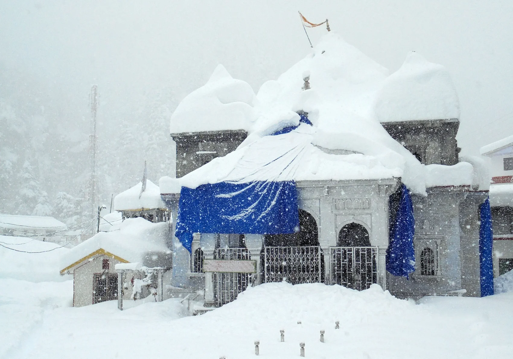Snow-covered Gangotri Temple during Char Dham Yatra. It's winter, lots of snow here.
