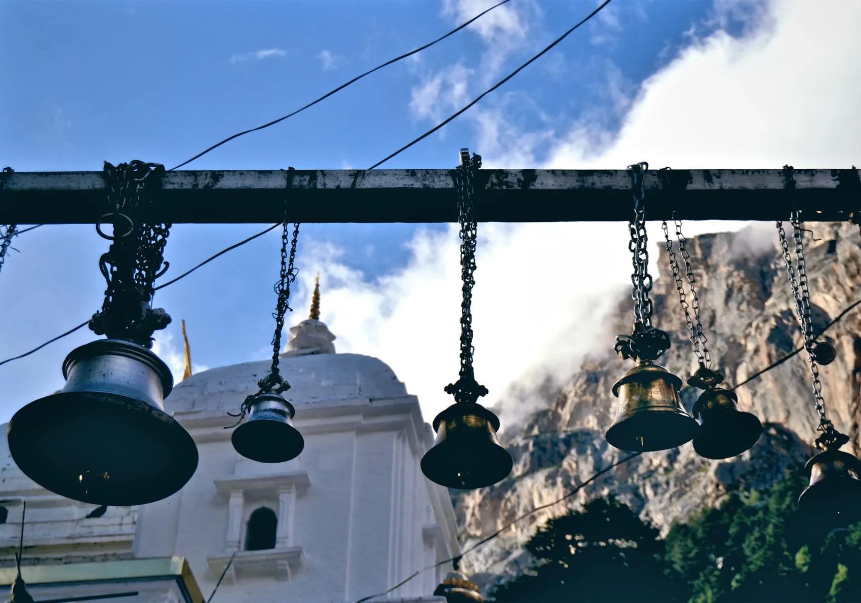 Gangotri Temple bells hanging for Char Dham Yatra pilgrims.