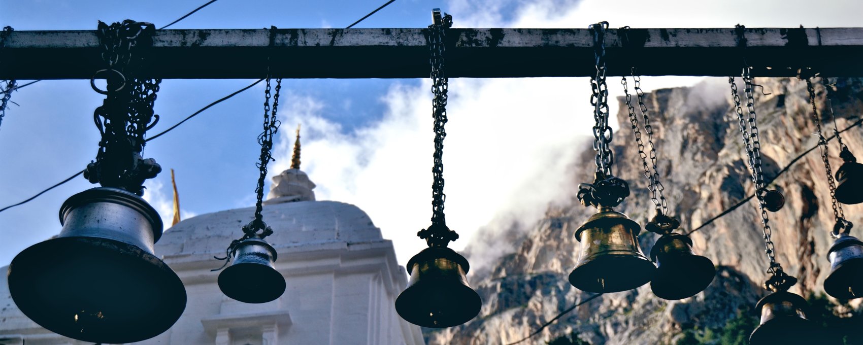 Pilgrims ring these bells at Gangotri temple, a Char Dham Yatra stop.