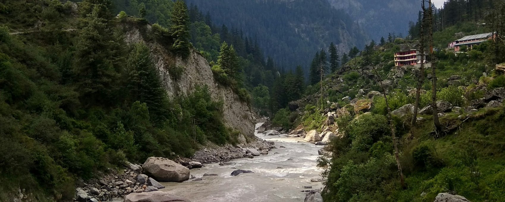 Mountain river scene near Gangotri Dham, part of the Chardham yatra pilgrimage route.