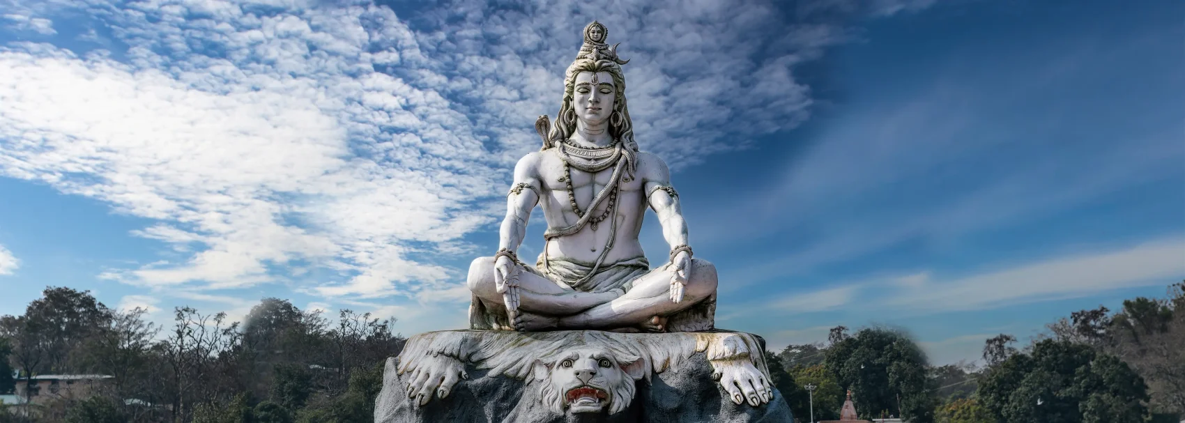 Meditating Shiva near the Ganges in Rishikesh, gateway city for the Char Dham Yatra pilgrimage.