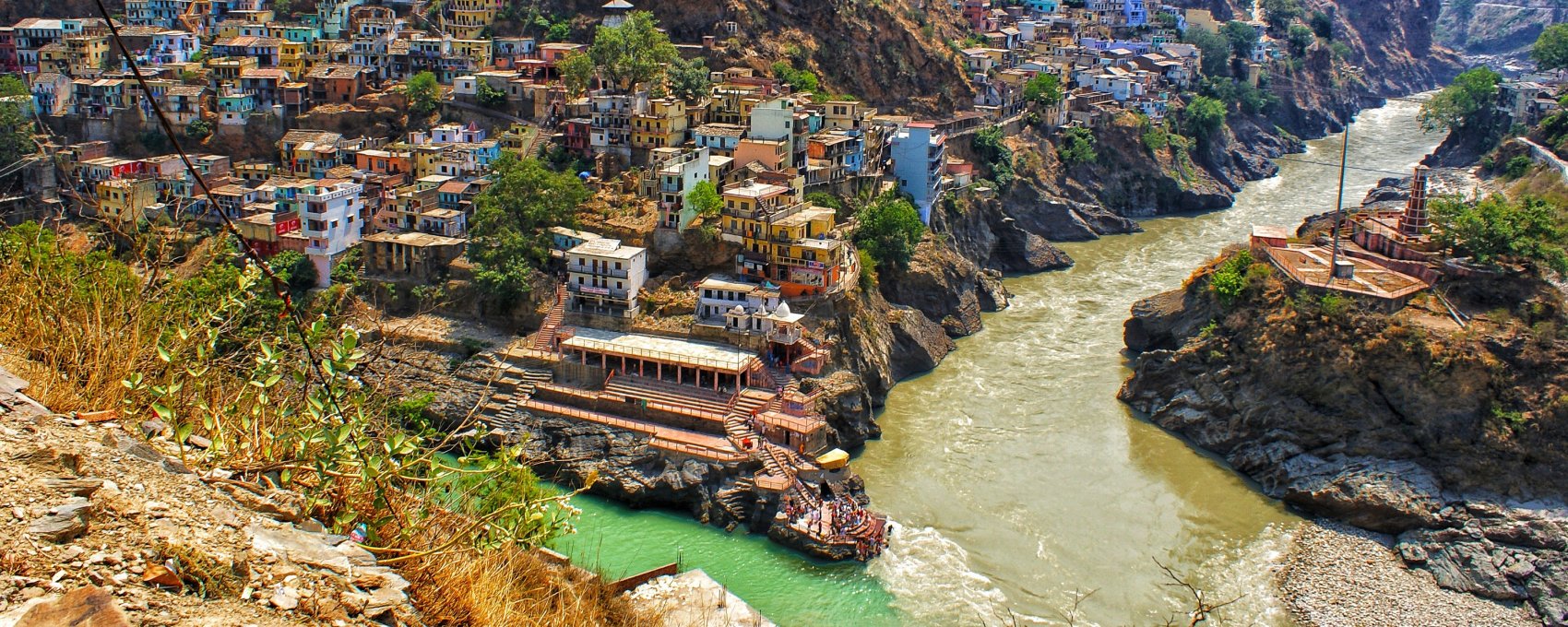 View of Devprayag, Uttarakhand, Ganges river formed by Alaknanda, Bhagirathi, a Char Dham pilgrimage site.