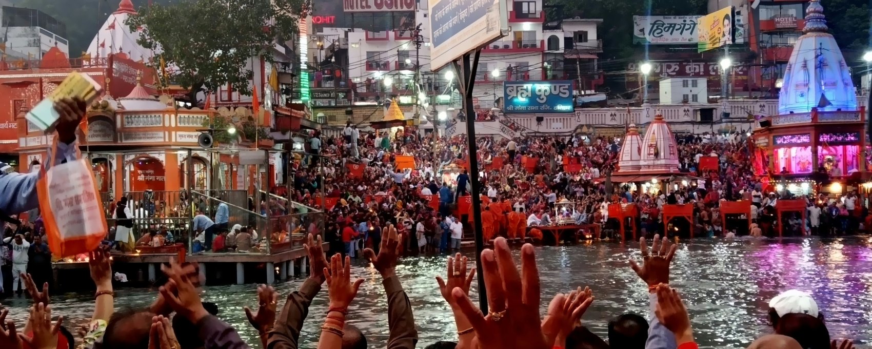 Pilgrims gather for Ganga Aarti at Brahma Kund in Haridwar, on the way to Char Dham Yatra. Very sacred place for Hindus.