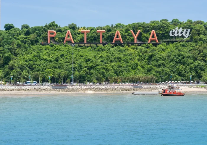 Pattaya city sign on green hill. Great view for a Pattaya tour photo.