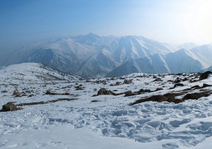 Snow-capped mountains in Gulmarg. Perfect views on your Kashmir tour. Book your snowy escape today!